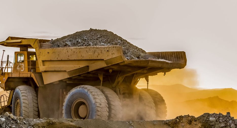 A large truck carrying sand on a platinum mining site in Africa